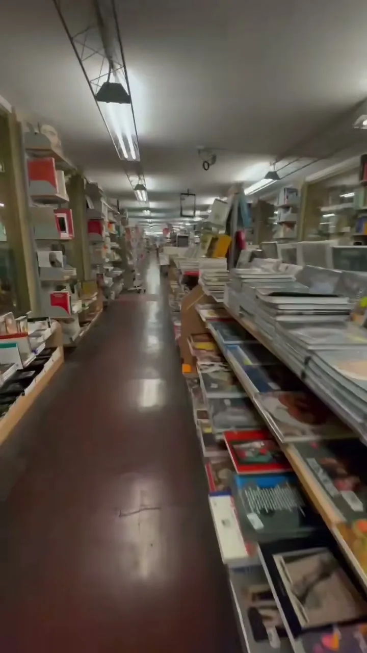 Empty bookstore aisle in long perspective