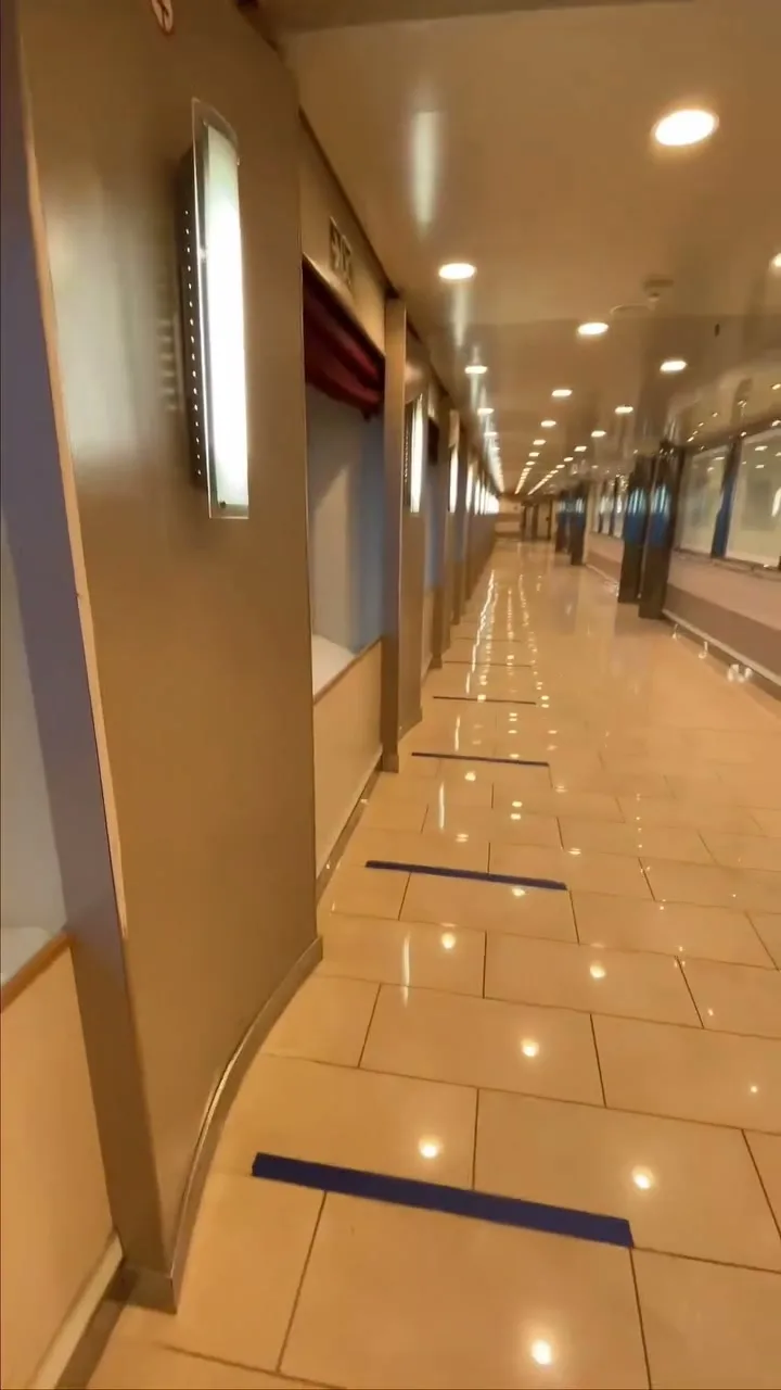 Long empty corridor on a ship, warm lighting